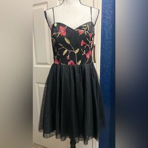 Chic Black Dress with Red Floral Design